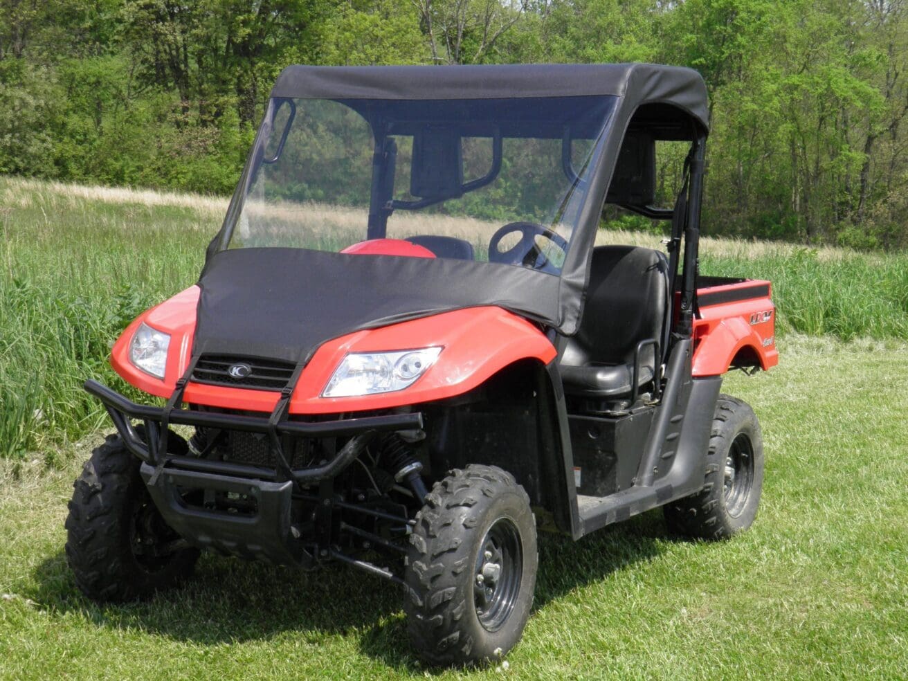 Red utility vehicle with windshield.