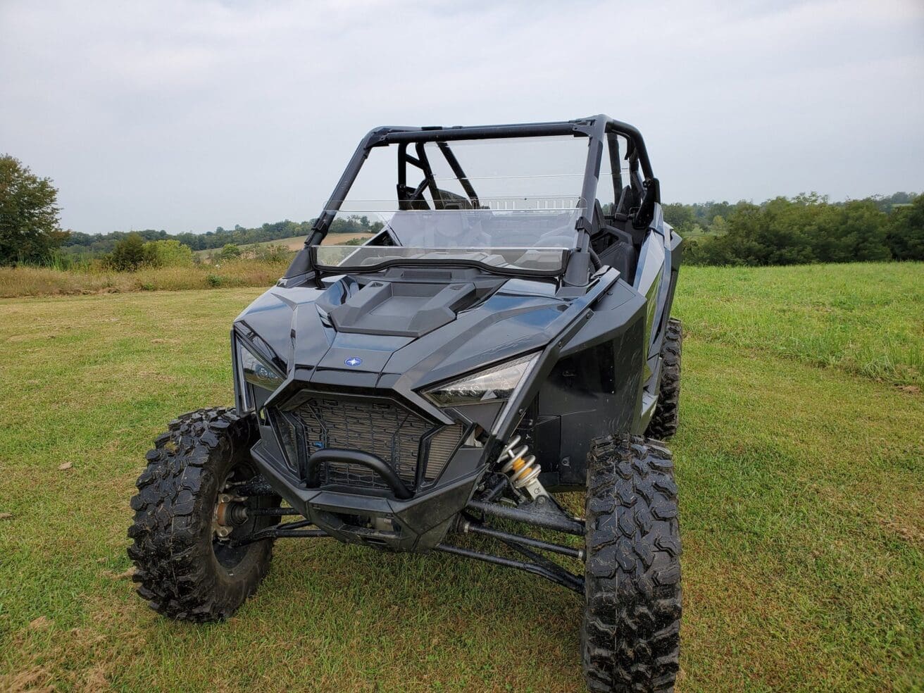 Black Polaris RZR off-road vehicle.