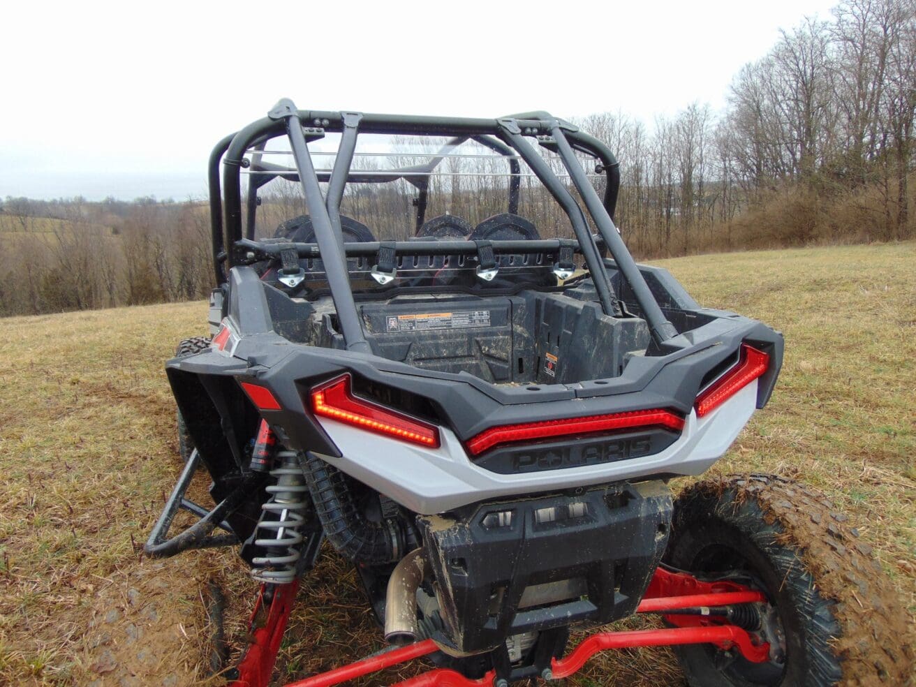 Rear view of a Polaris RZR off-road vehicle.