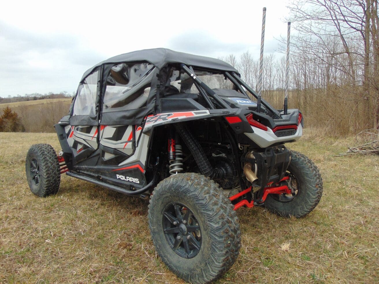 Polaris RZR off-road vehicle in field.