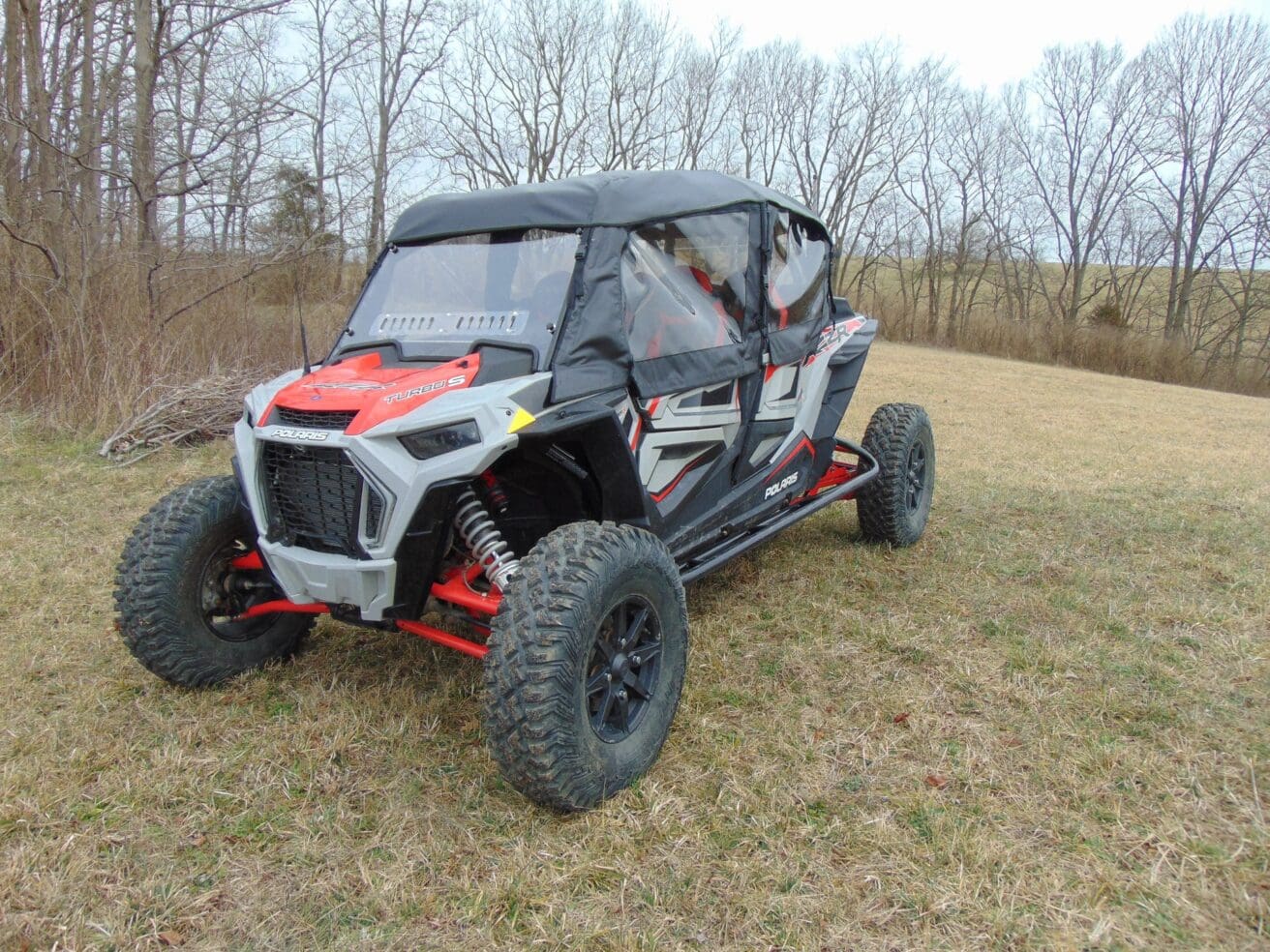 Gray Polaris RZR Turbo S in field.