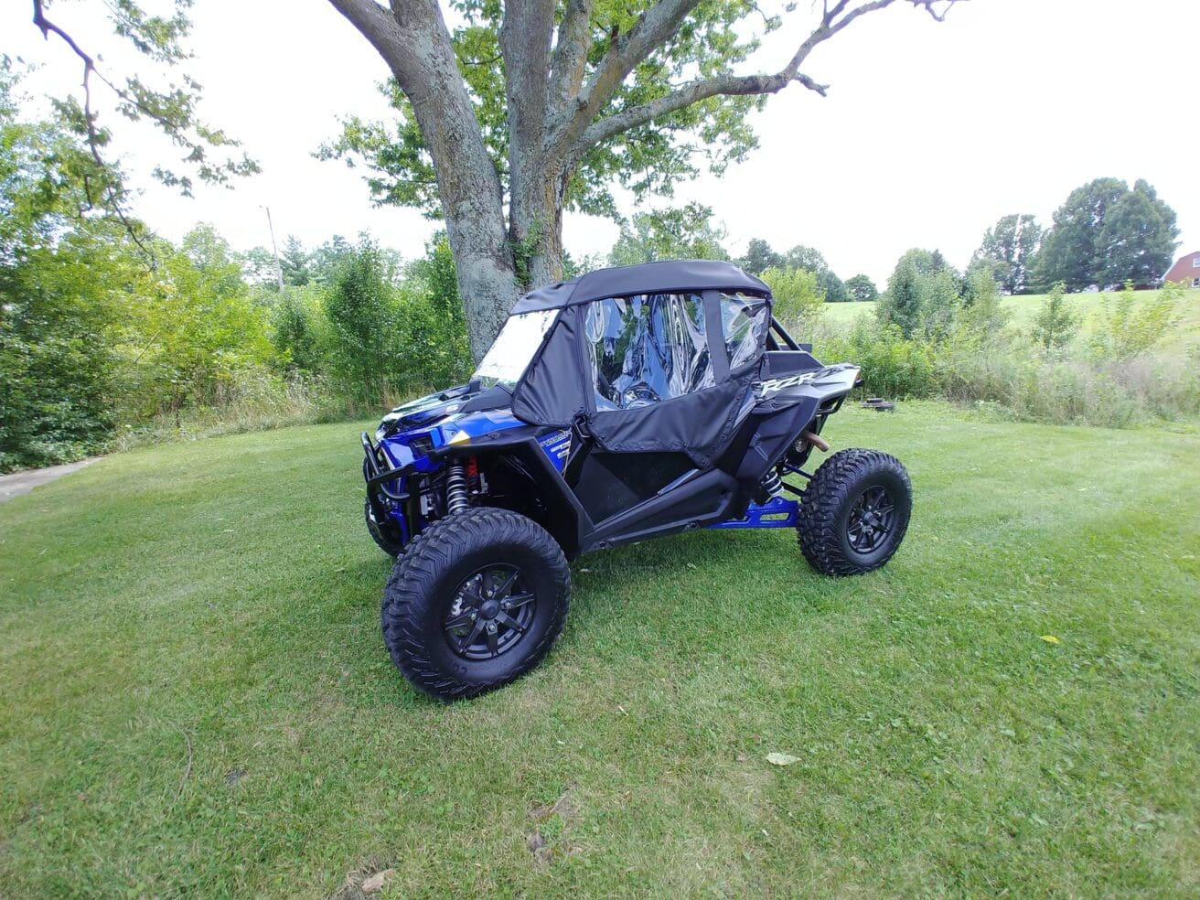 Blue Polaris RZR off-road vehicle.