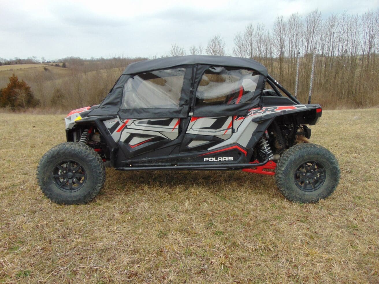 Polaris RZR side-by-side in field.