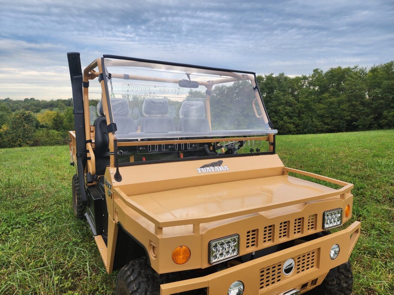 Tan Tutara utility vehicle with windshield.