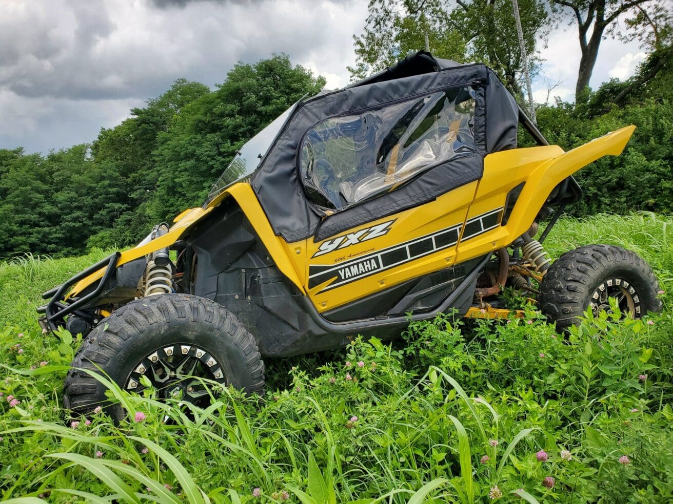 Yellow Yamaha YXZ1000R in field.
