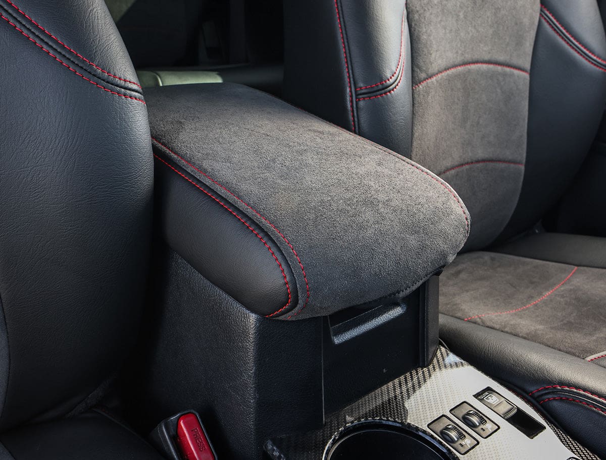 Car center console armrest with red stitching
