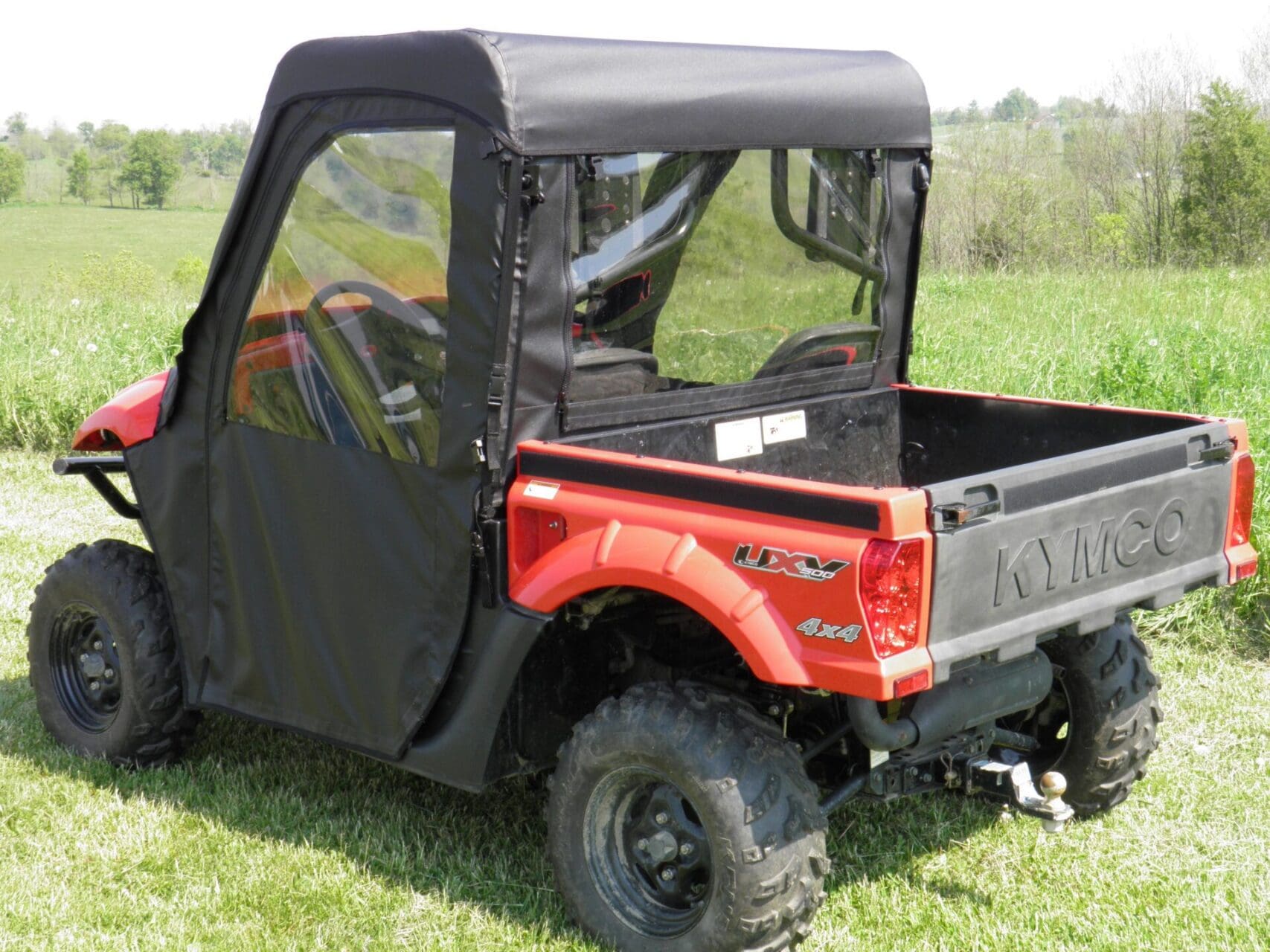 Red utility vehicle with black enclosure.