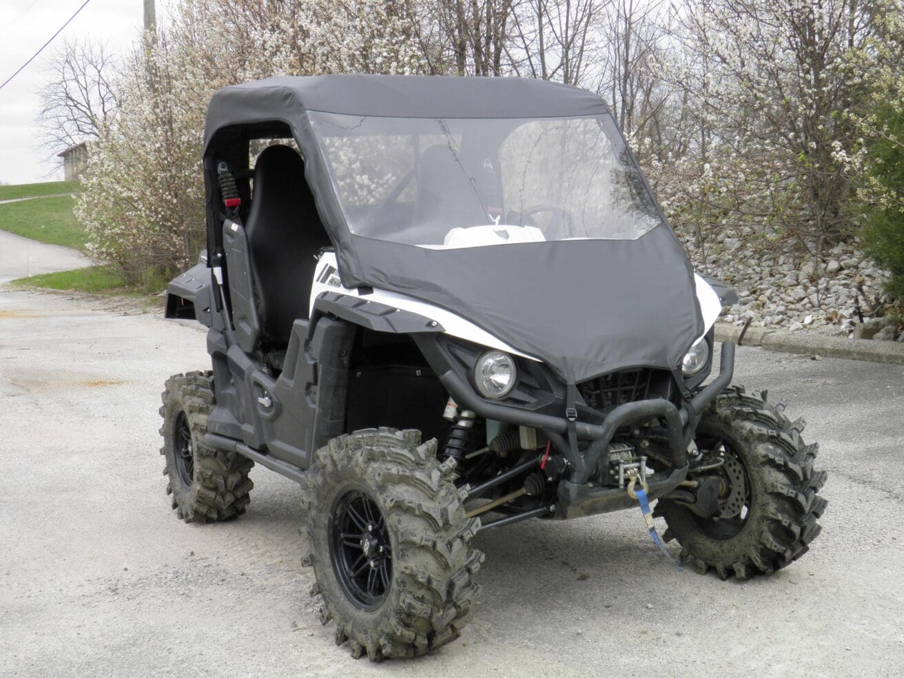 Black off-road UTV with mud tires