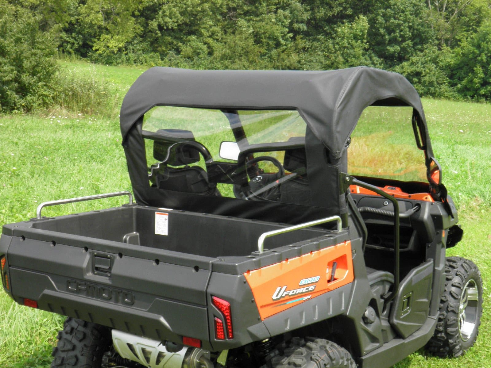 Orange utility side-by-side UTV with cargo bed
