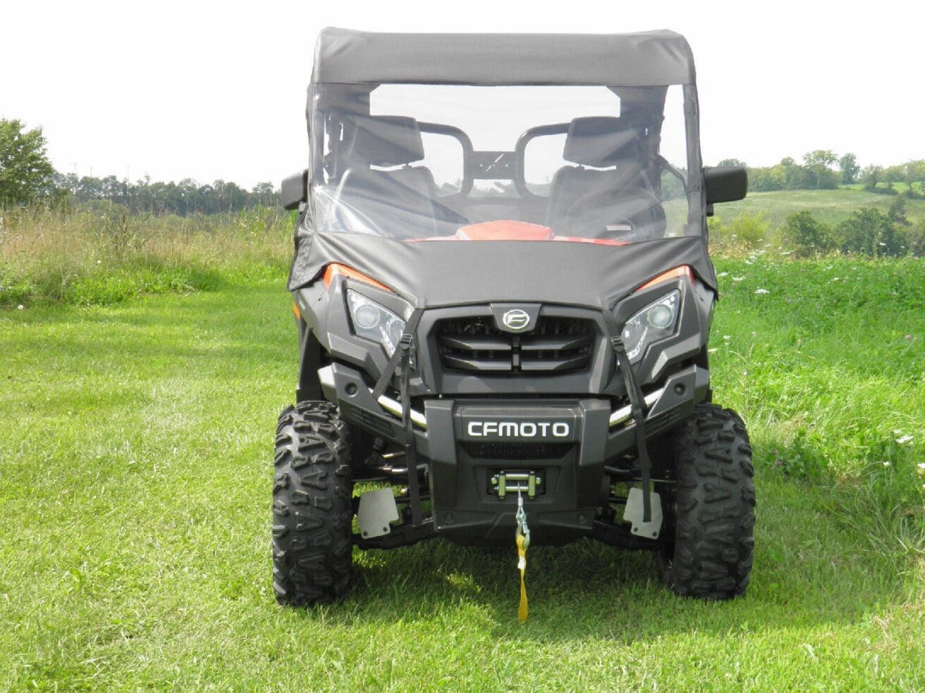 CFMOTO UTV parked on grassy field