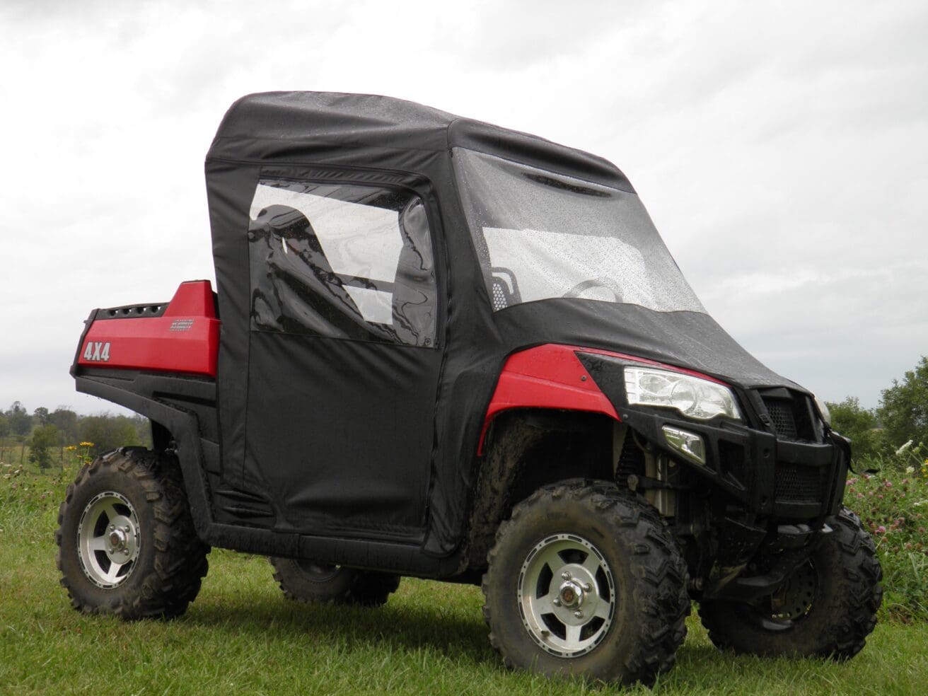 Red UTV with black cab enclosure