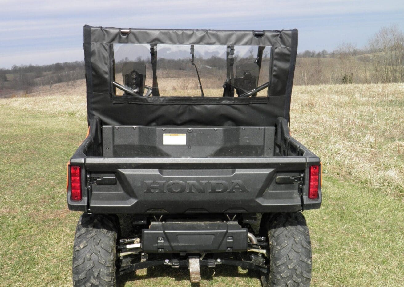 Rear view of Honda UTV in field
