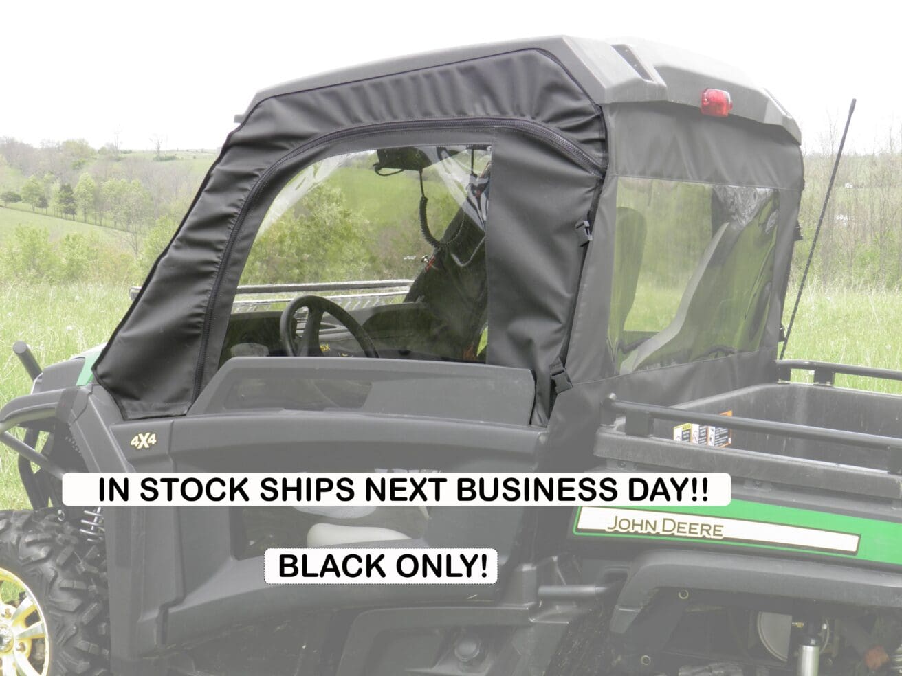 John Deere Gator UTV with black soft cab