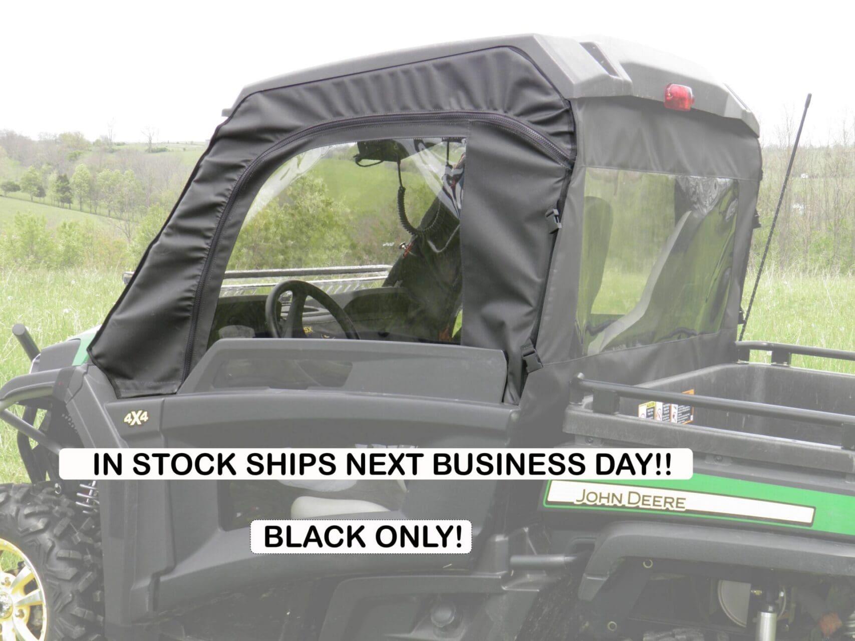 John Deere Gator UTV with black soft cab