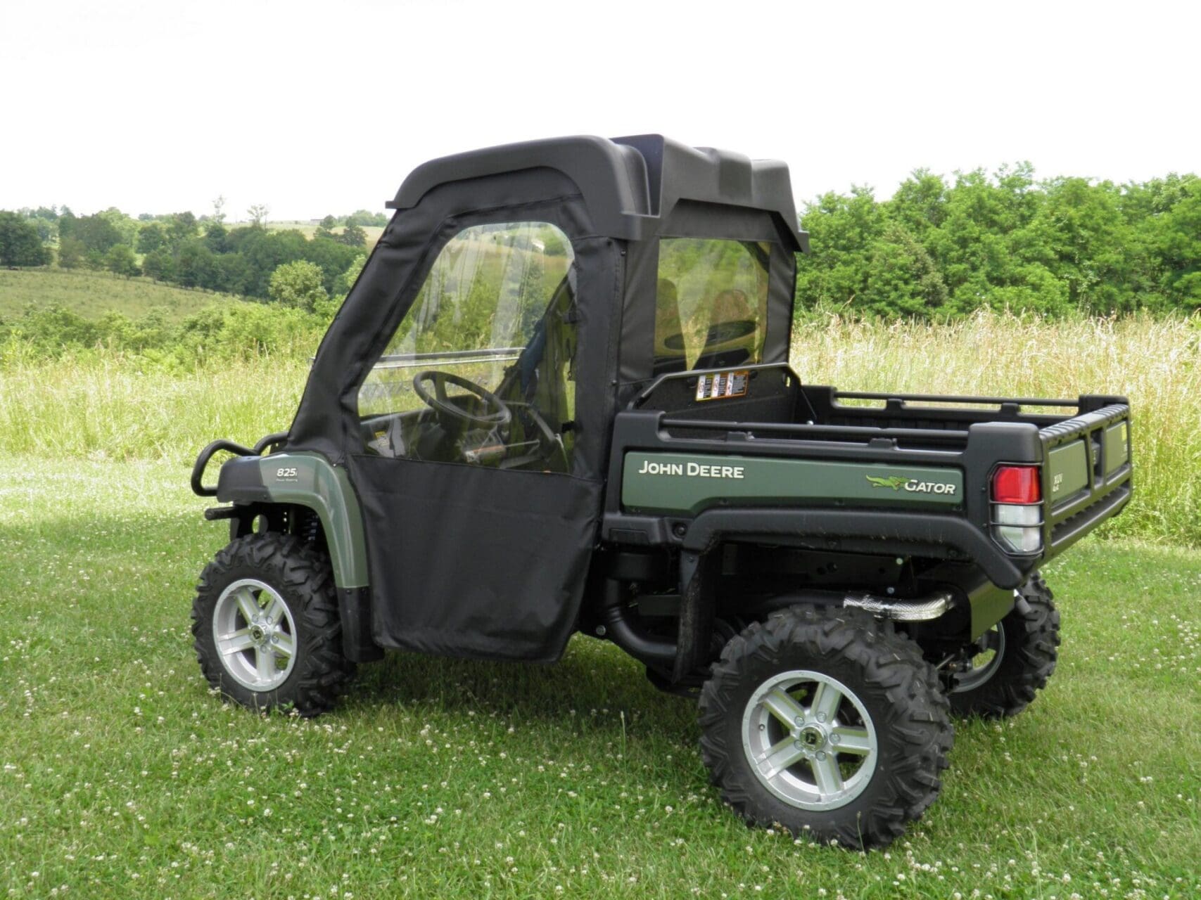 Enclosed-cab John Deere Gator utility vehicle