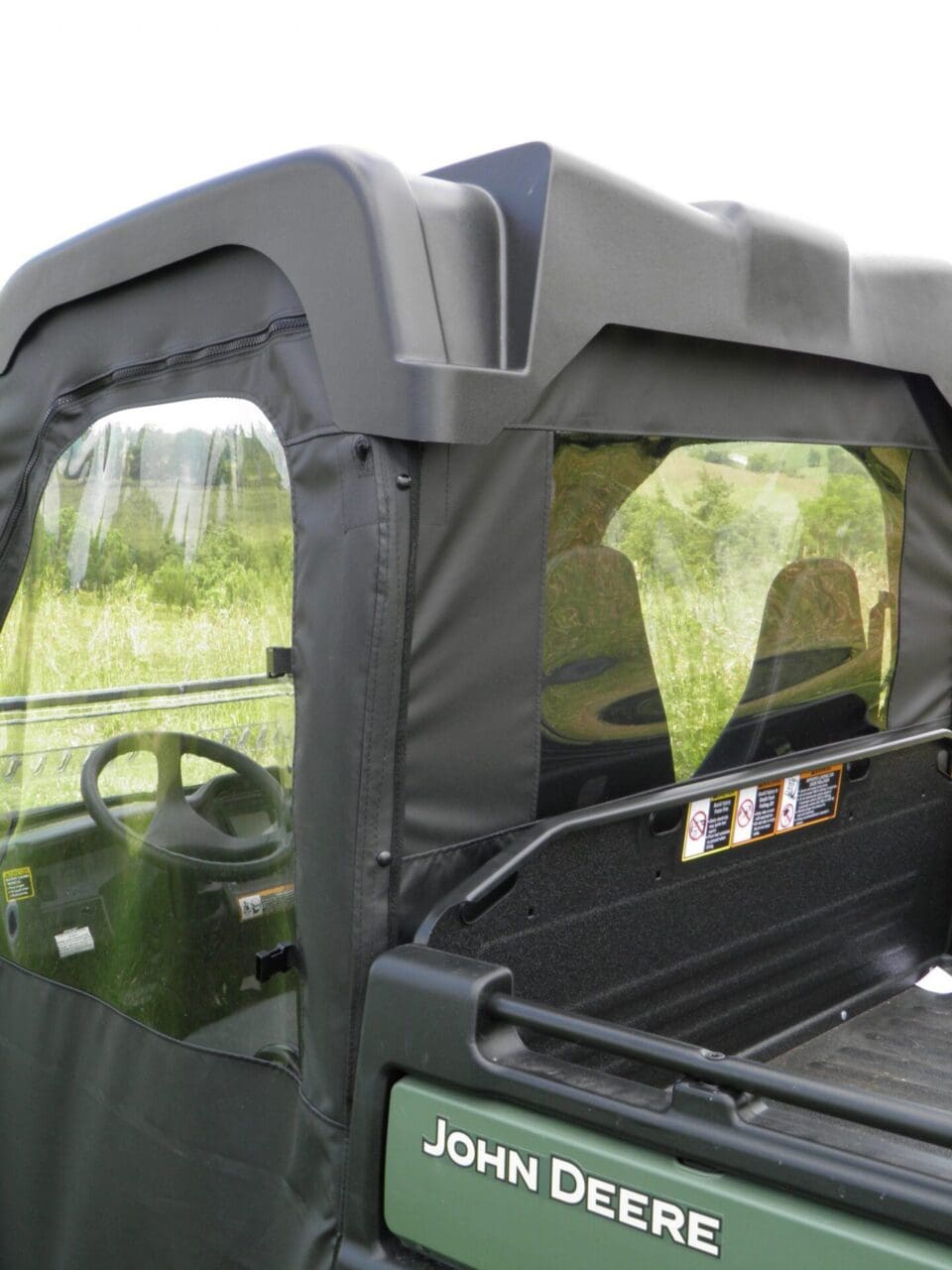 John Deere utility vehicle with enclosed cab