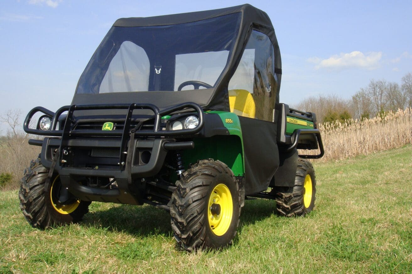 John Deere green utility vehicle with cab