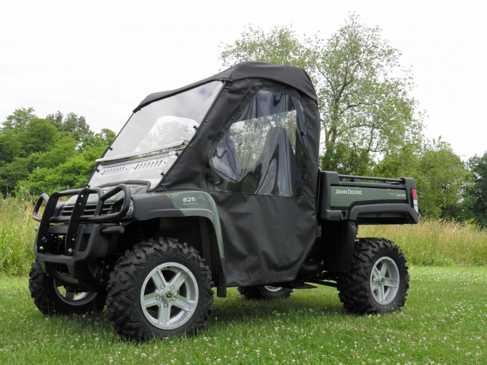 John Deere Gator utility vehicle with enclosed cab
