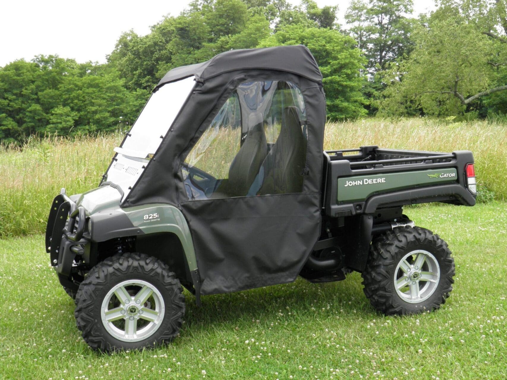 John Deere Gator utility vehicle with cab enclosure