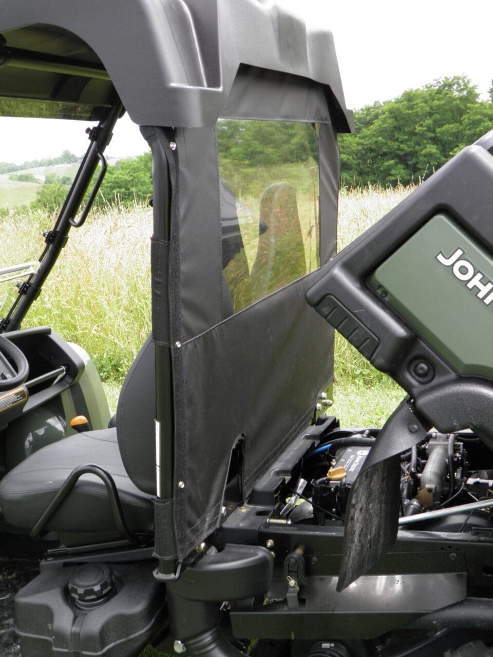 John Deere utility vehicle with mesh side panel