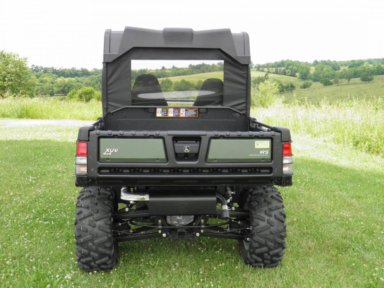 Green off-road utility vehicle rear view