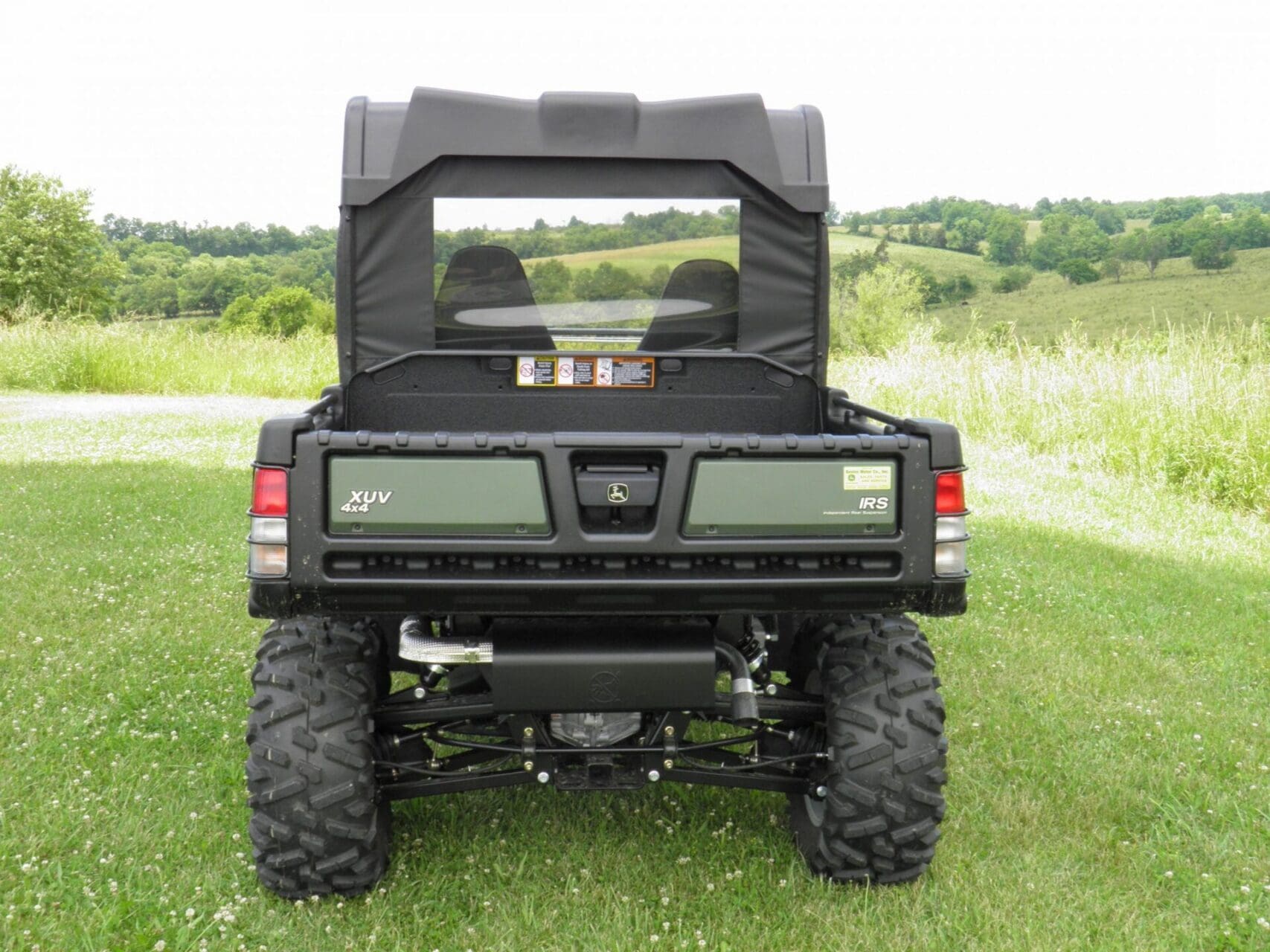 Green off-road utility vehicle rear view