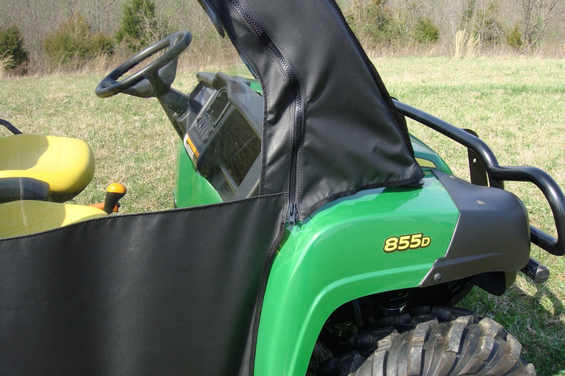 Green John Deere 855D utility vehicle