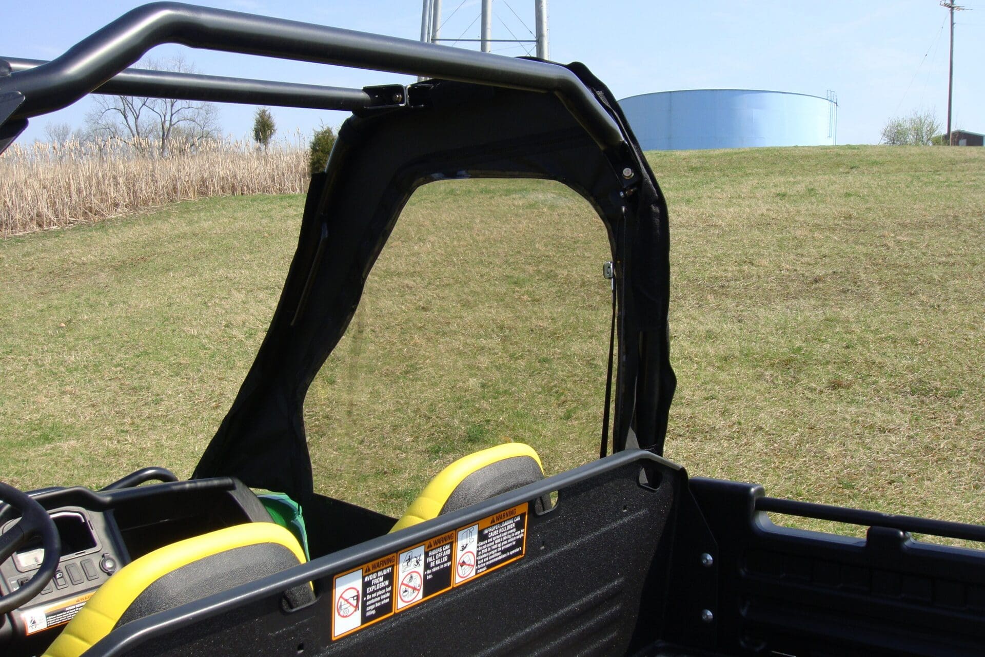 UTV interior with yellow seats and rollbar
