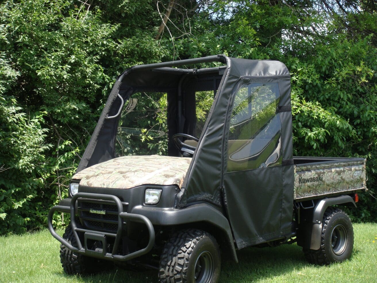 Camouflage utility side-by-side vehicle on grass