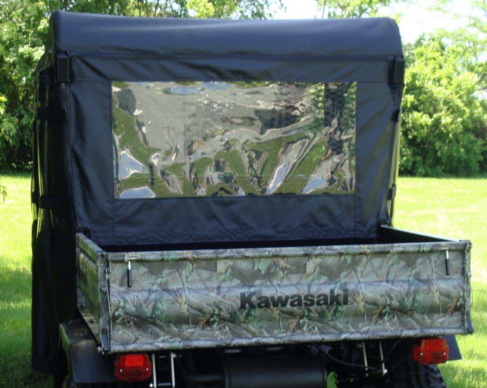 Kawasaki utility vehicle with camo cargo cover