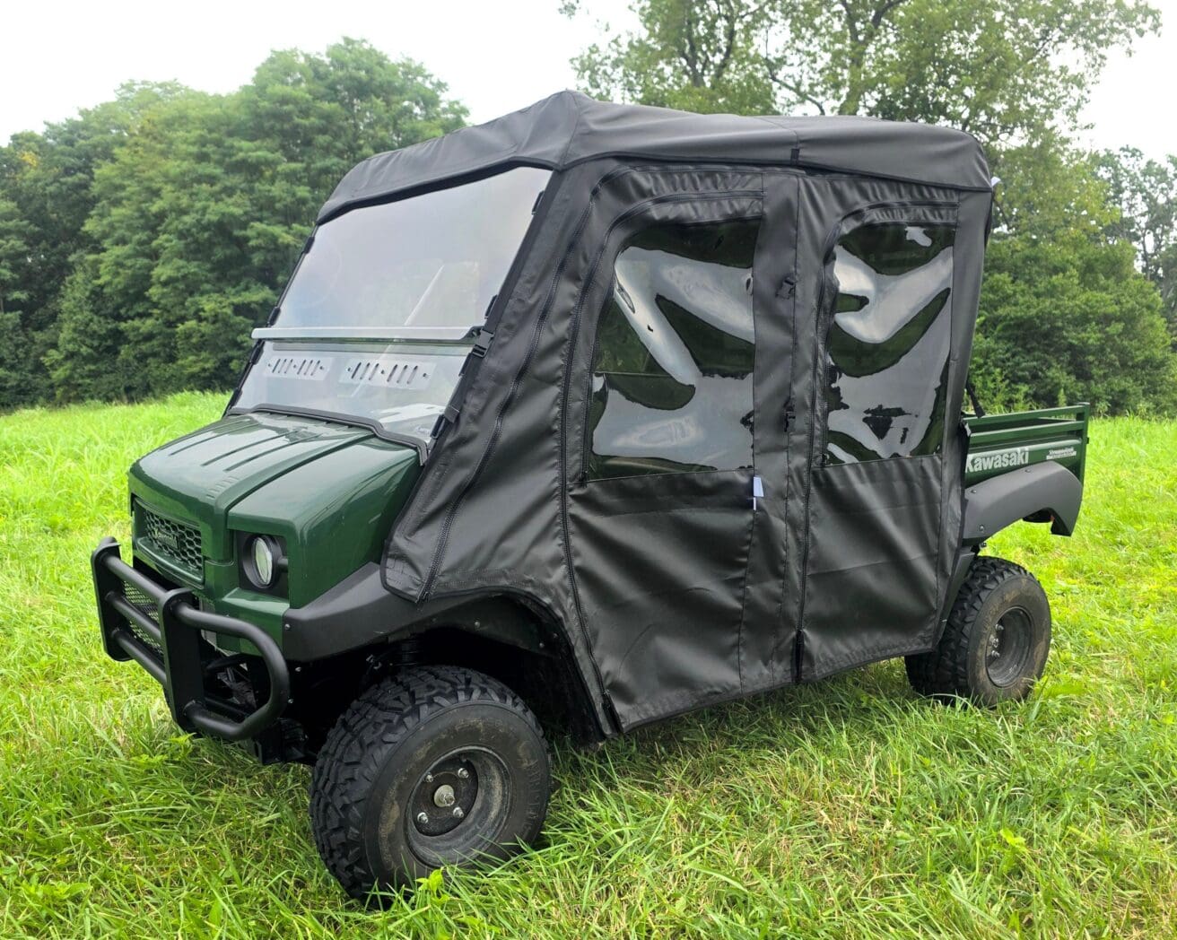 Green utility UTV with black soft cab