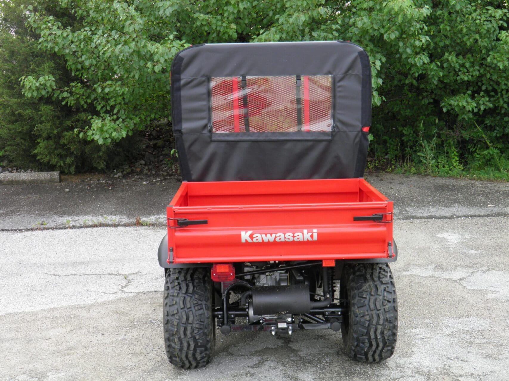 Rear view of red Kawasaki utility vehicle