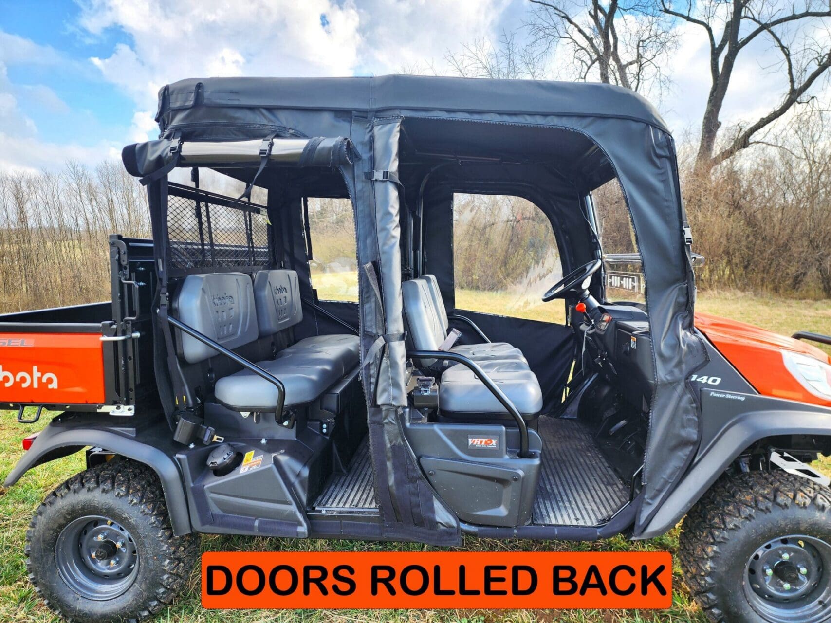 Utility vehicle with open doors and seating.