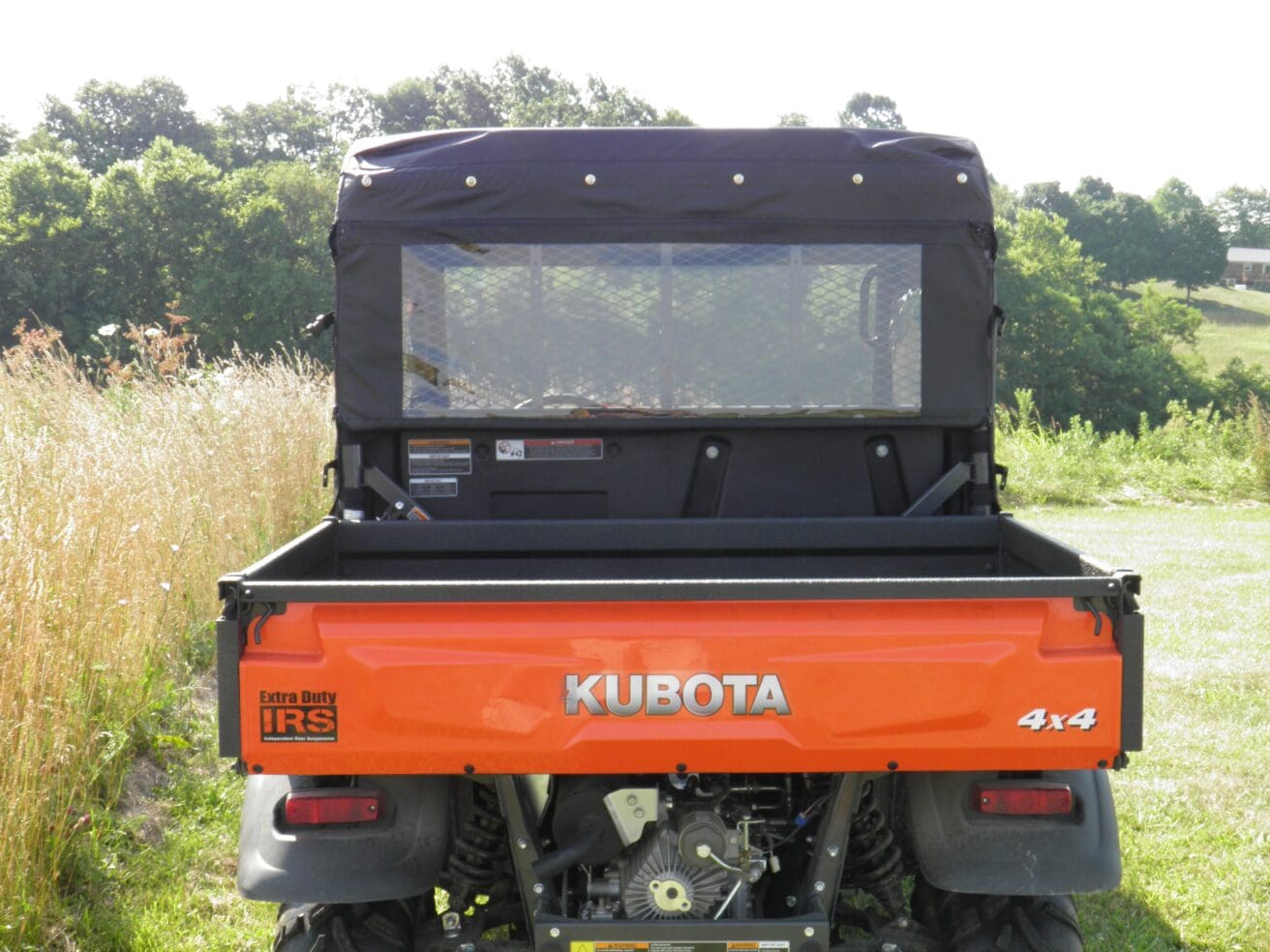 Rear view orange Kubota 4x4 utility vehicle