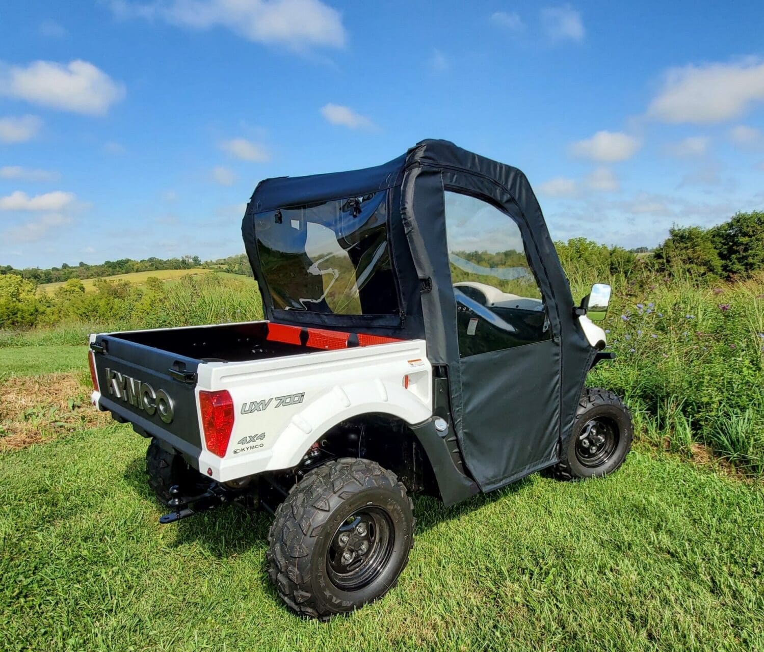 Utility vehicle with soft cab and rear window.