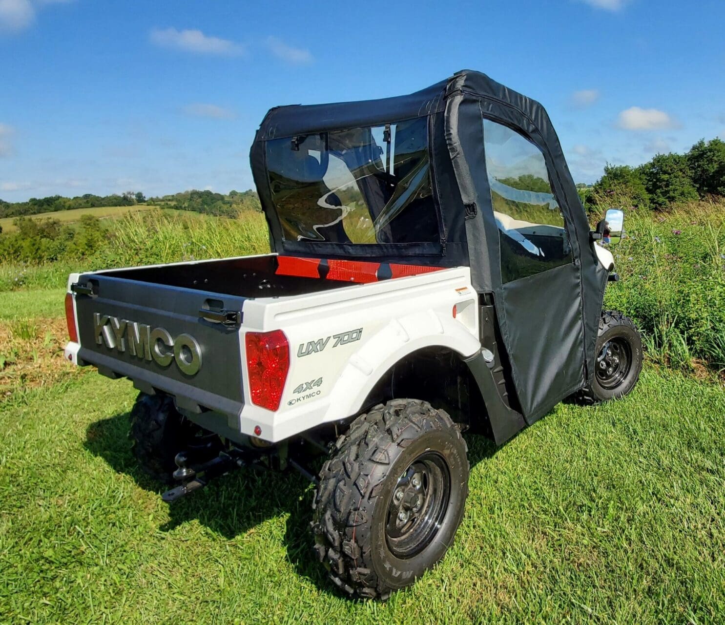 KYMCO utility vehicle with soft cab enclosure.