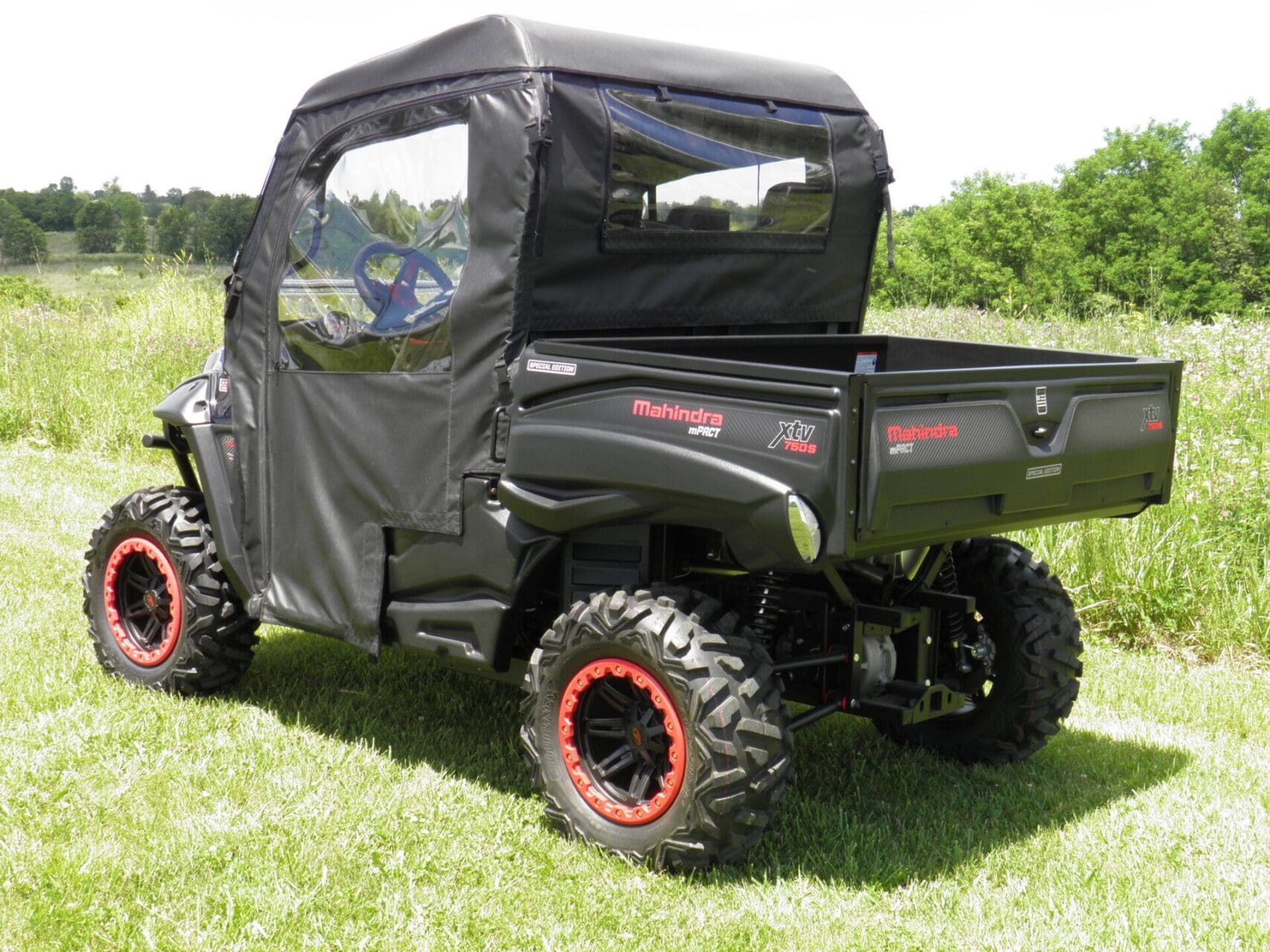 Utility vehicle with black soft cab enclosure.