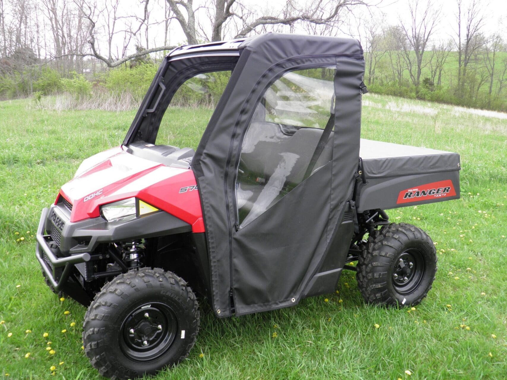 Utility vehicle with partial vinyl enclosure.
