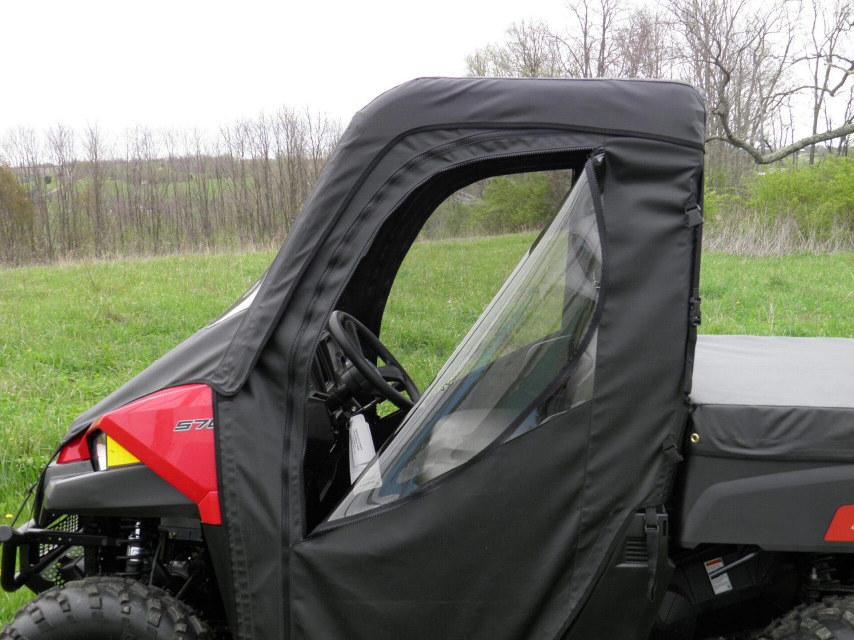 Vinyl enclosure with clear side window feature.