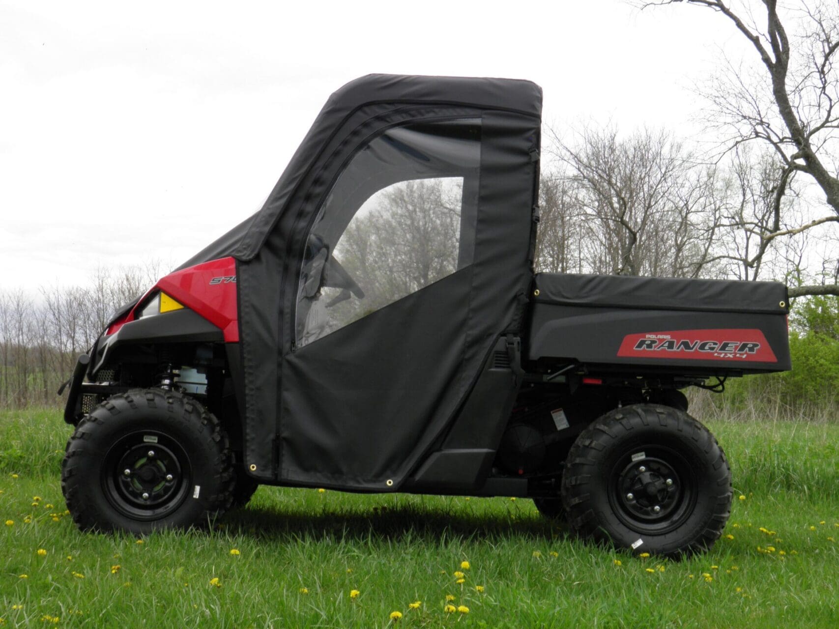 Side view of a utility vehicle enclosure.