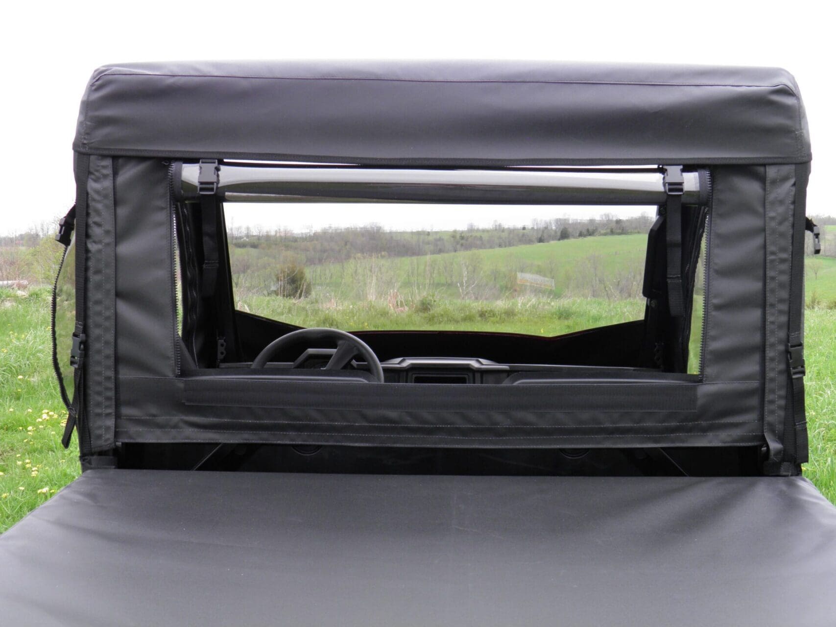 Zippered rear window on a black enclosure.