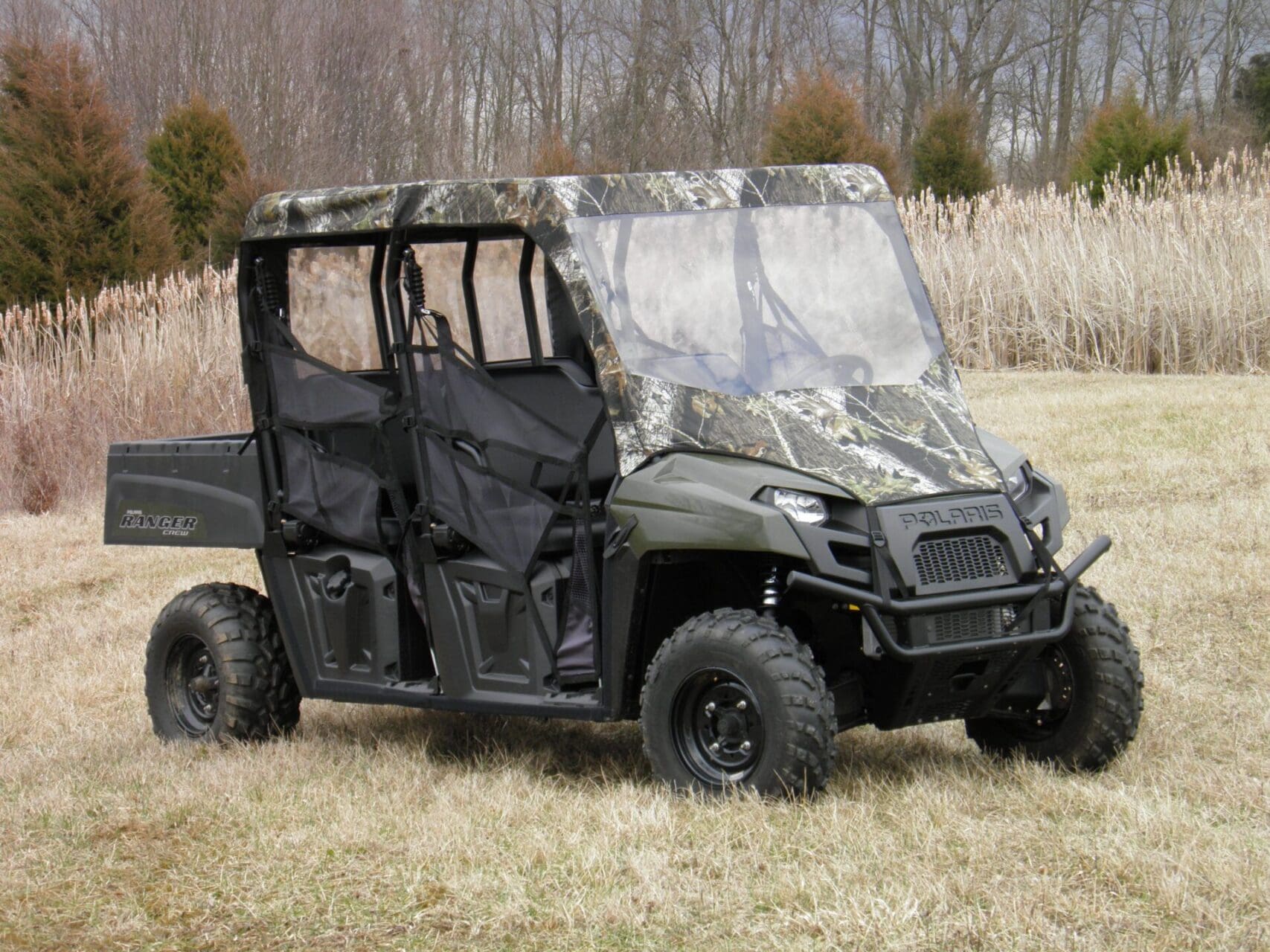 Camouflage side-by-side utility vehicle in field