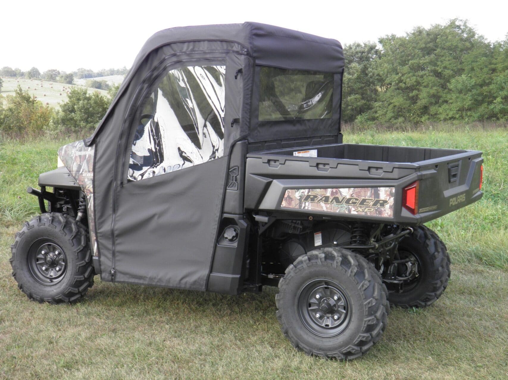 Utility vehicle with soft enclosure in nature.
