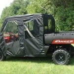 Enclosed utility vehicle with vinyl windshield