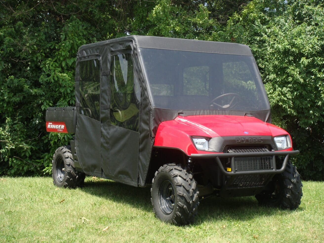 Red off-road utility vehicle with enclosure