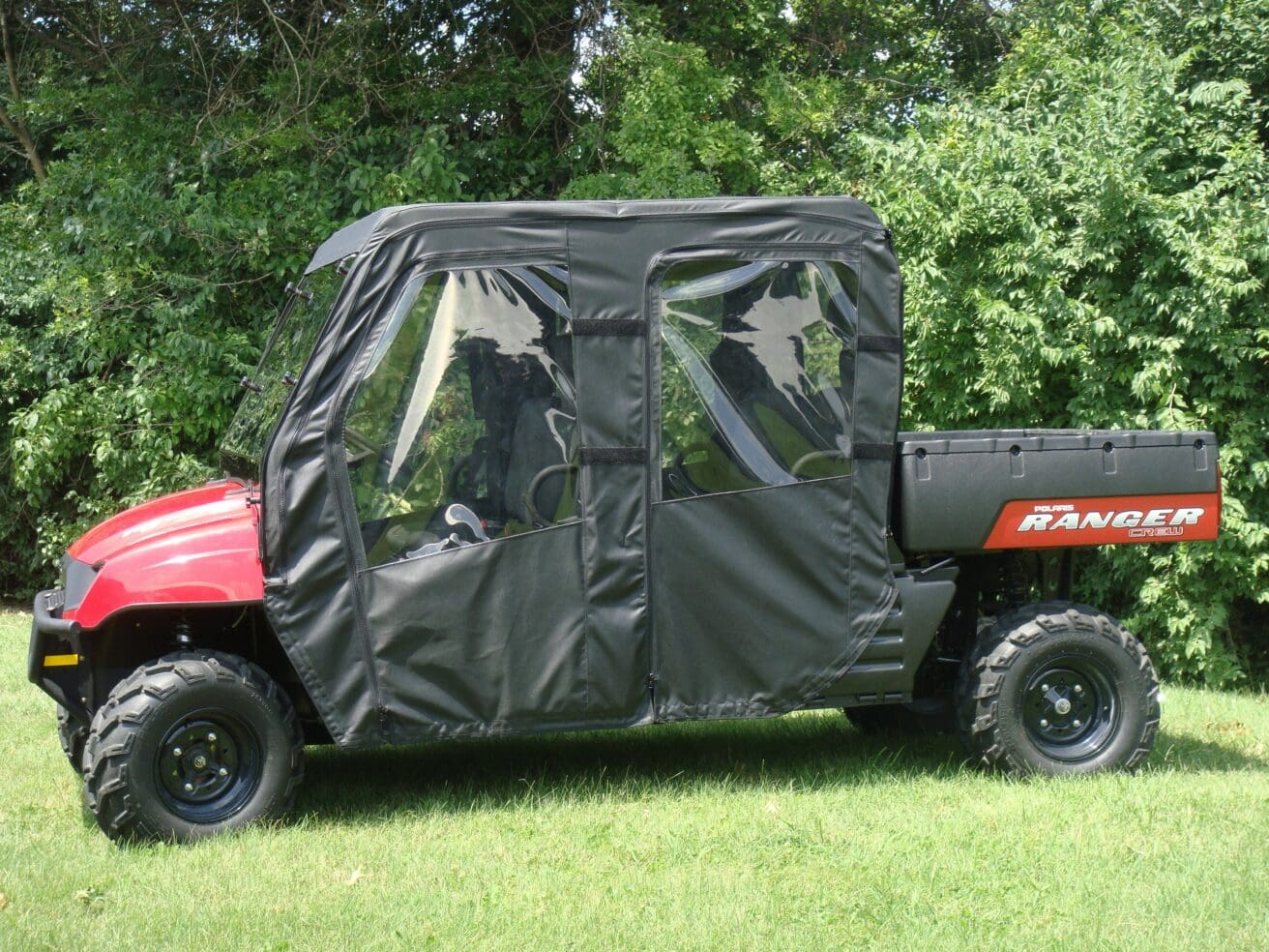 Red Ranger UTV with black canvas enclosure