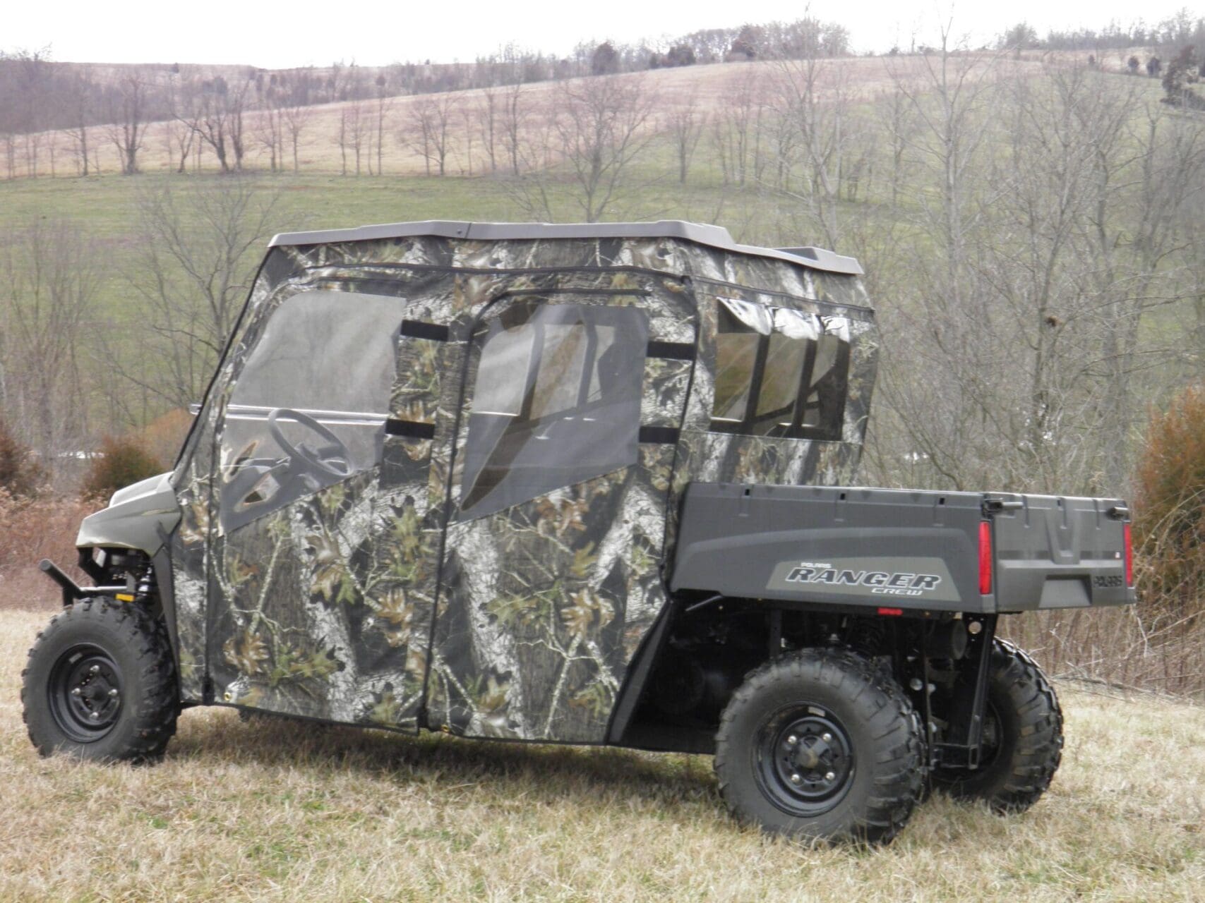 Camouflage side-by-side in grassy field