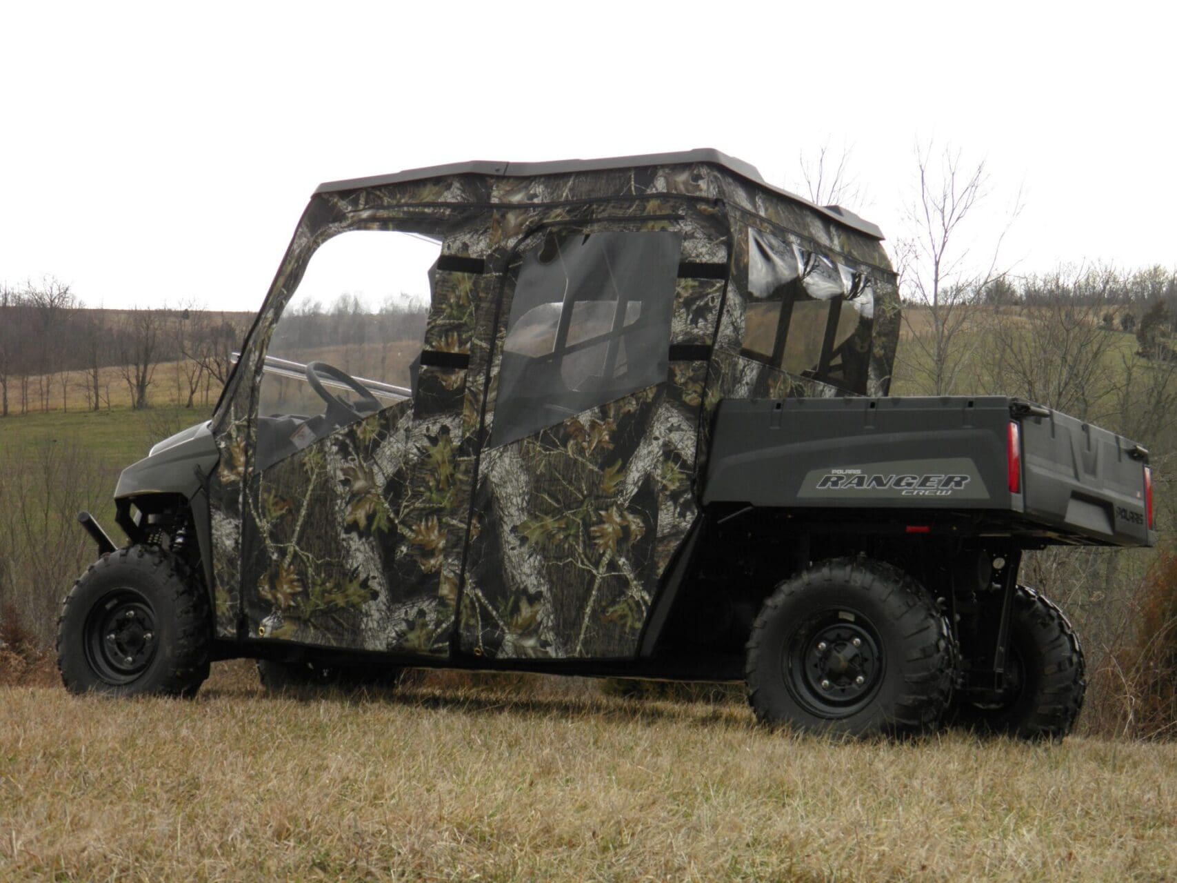 Camouflaged off-road utility vehicle with cabin