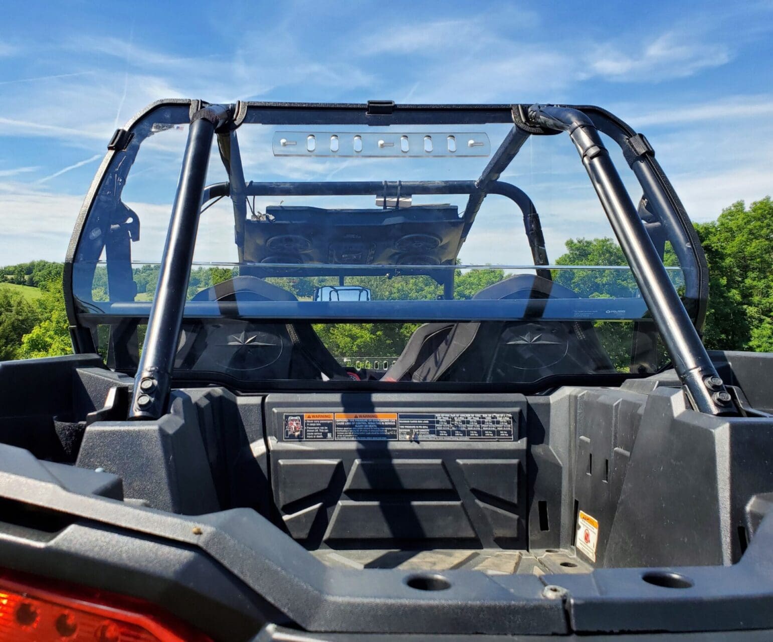 Rear view of off-road UTV with roll cage
