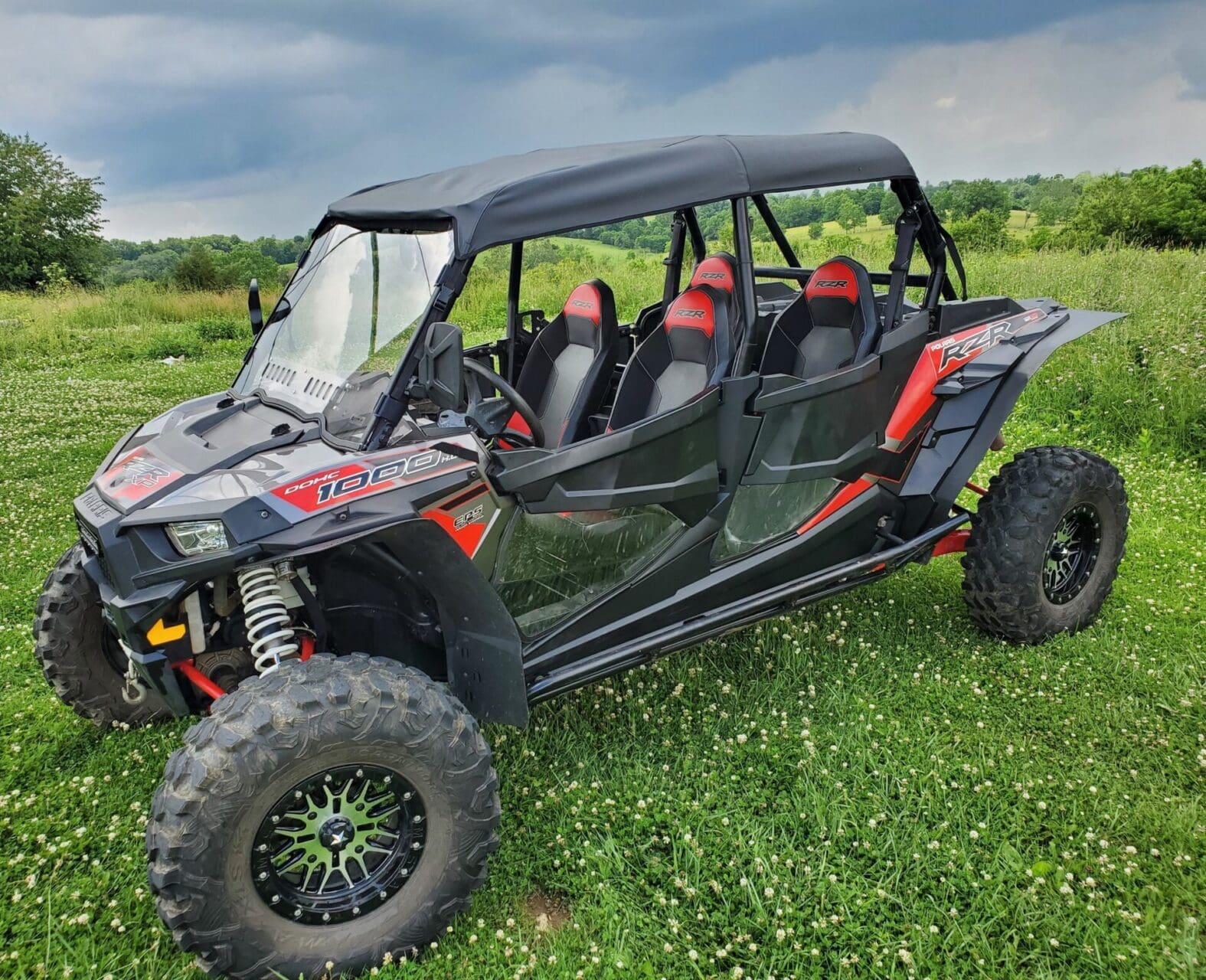 Red and black four-seat off-road UTV